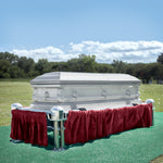 A Frigid Imperial Plain Package lowering device Sitting on a Frigid Telescoping Stand with Burgundy Drape and Graveside Grass Set