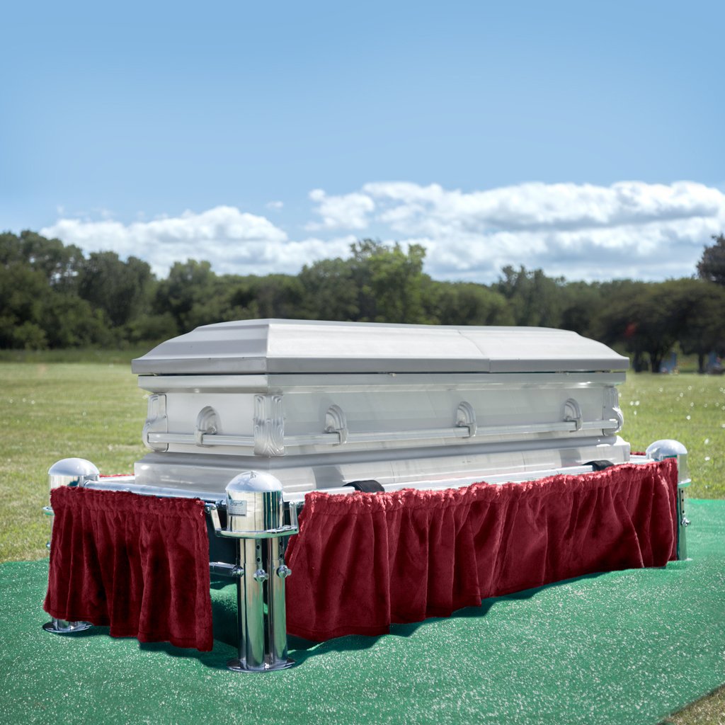 A Frigid Imperial Plain Package lowering device Sitting on a Frigid Telescoping Stand with Burgundy Drape and Graveside Grass Set